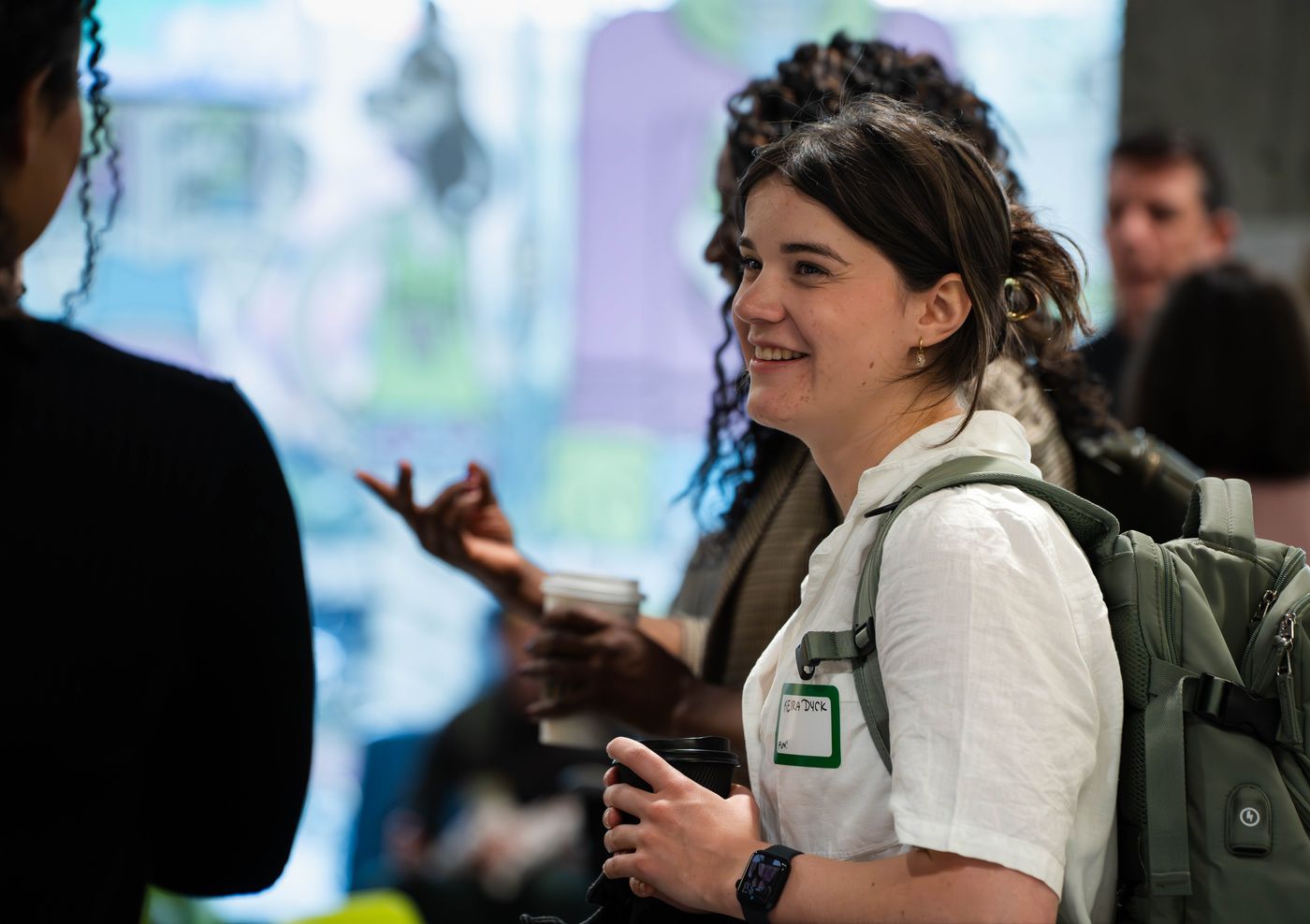 Attendee smiling in conversation