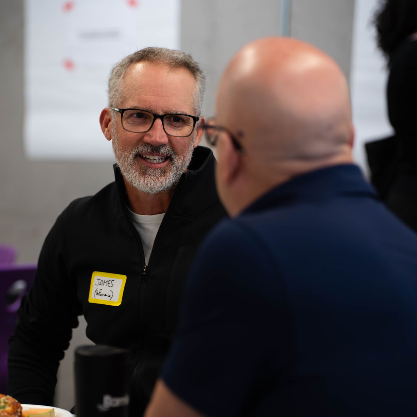 Two participants in discussion